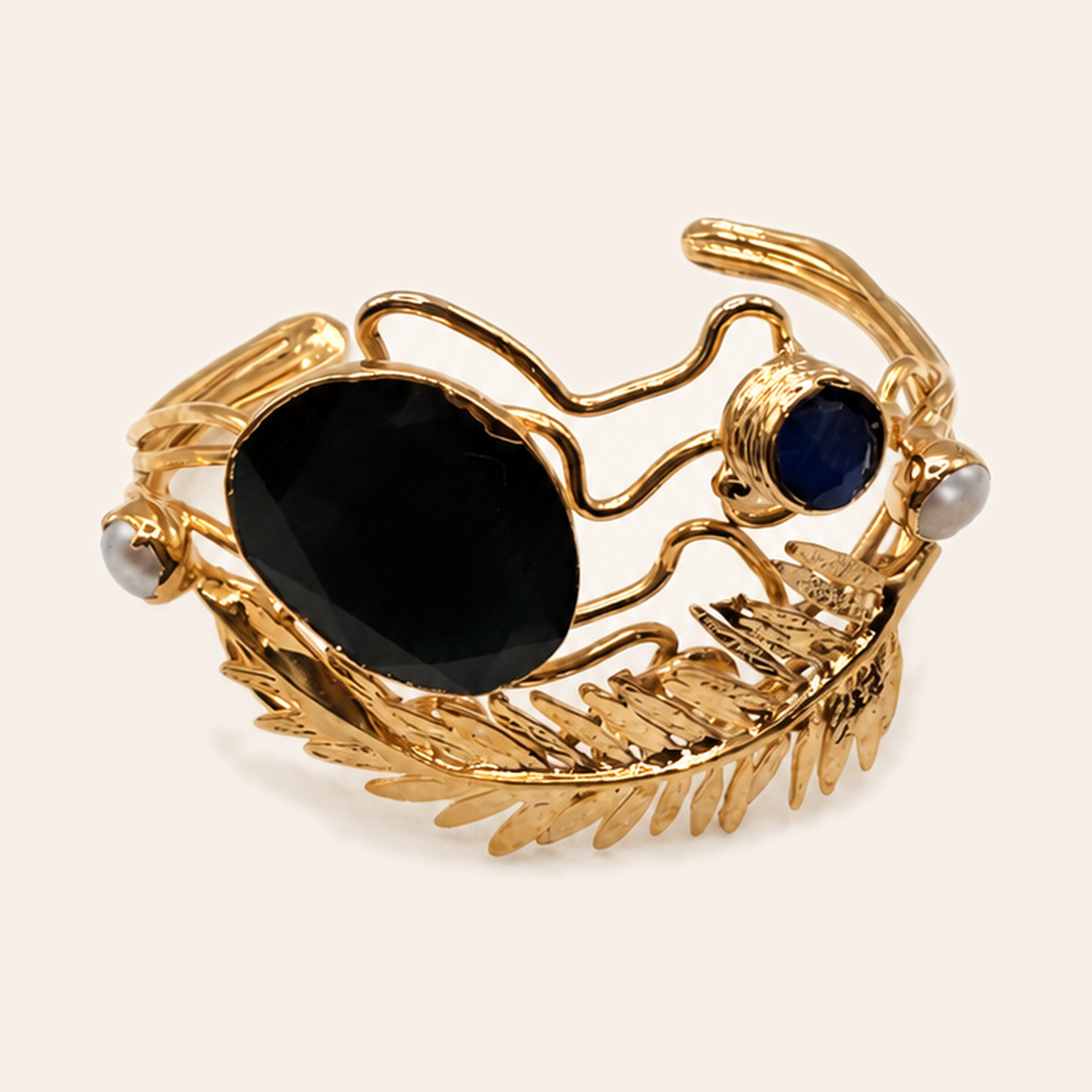 Black and gold oval leaf cuff with coloured stones