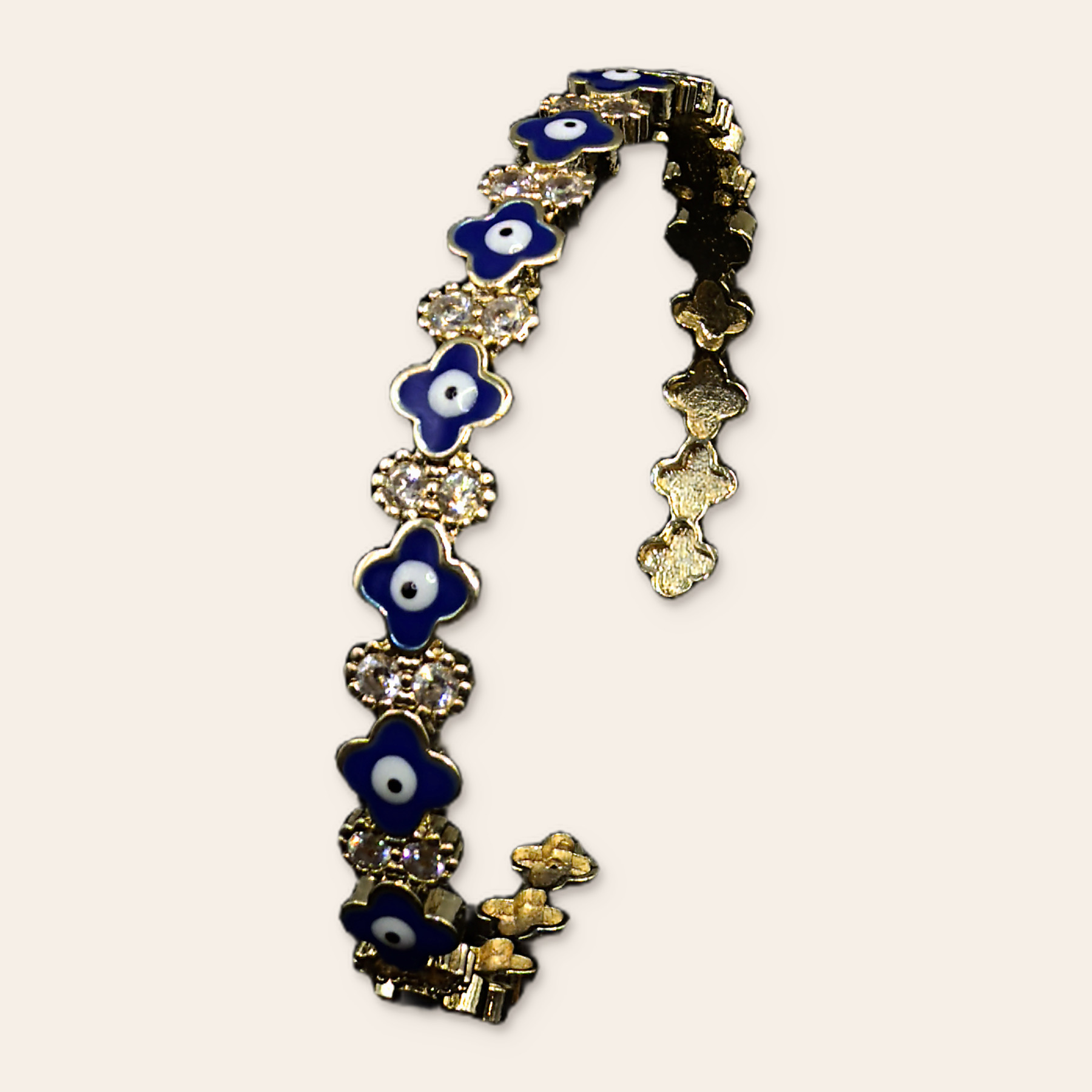 Cobalt blue charm bracelet on a Simie ecru background