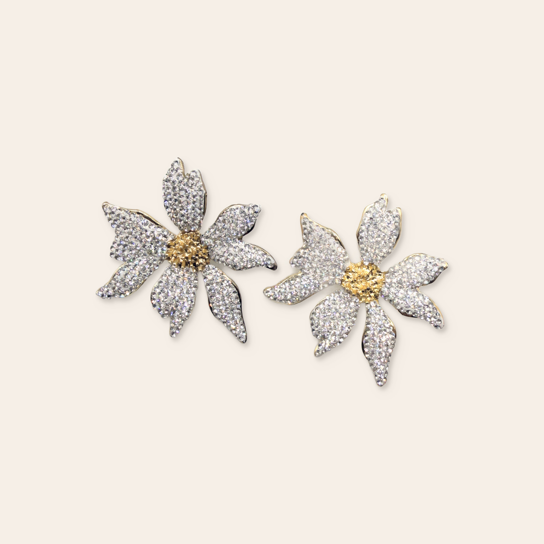 Crystal floral earrings on a Simie ecru background