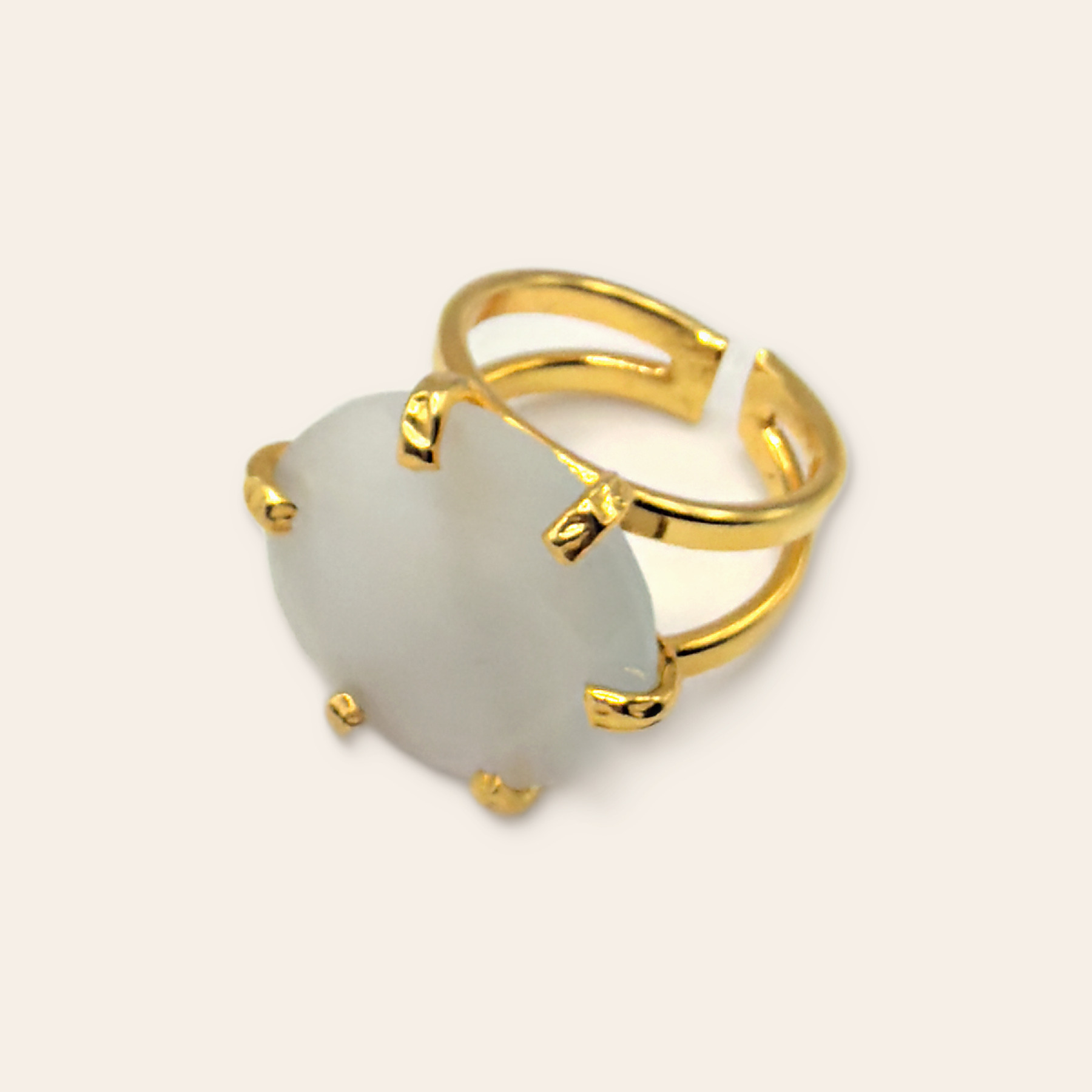 Pale stone ring on a Simie ecru background